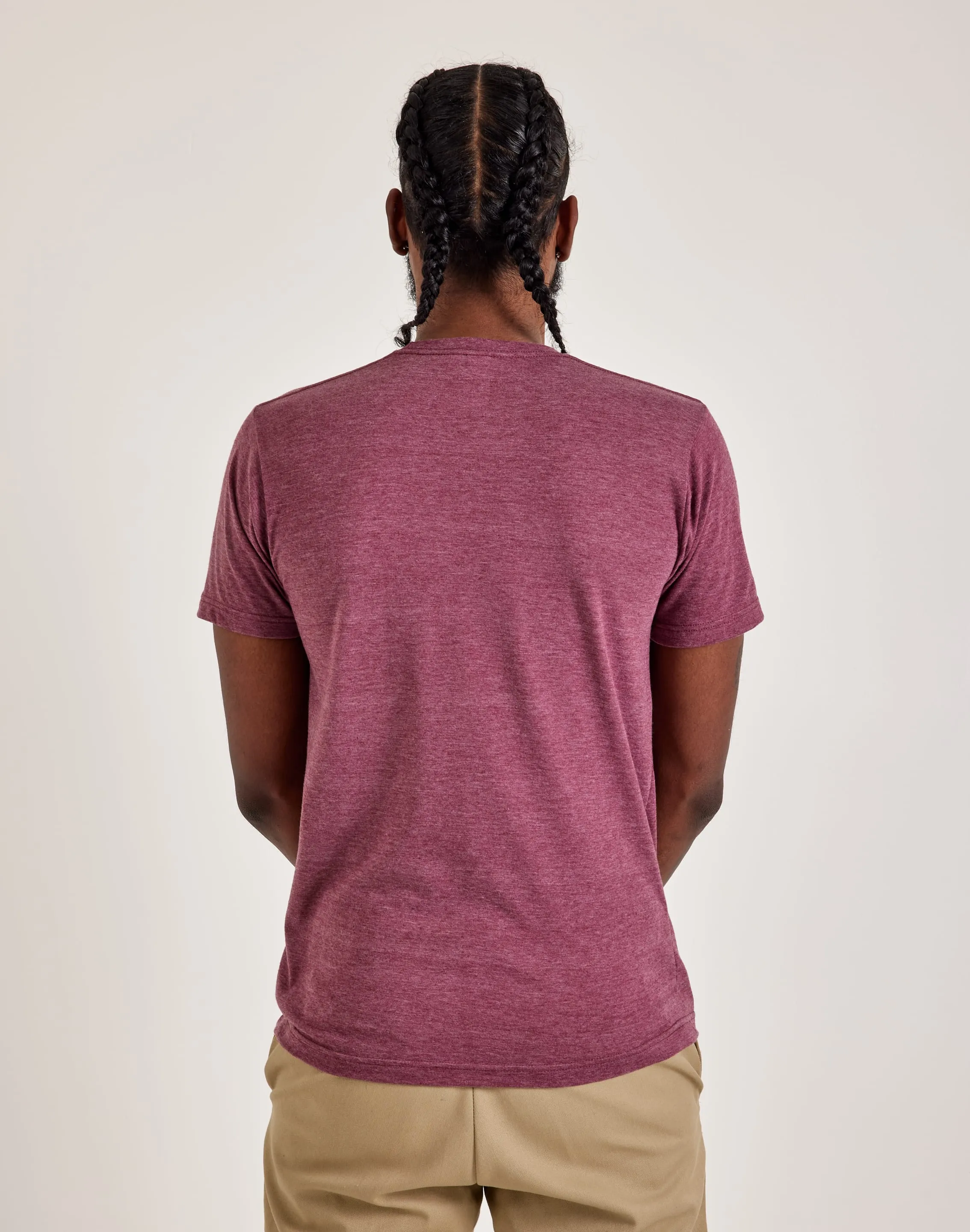 Model Glow SustainableTextiles LA Pop Art Word Art Hustle Tee