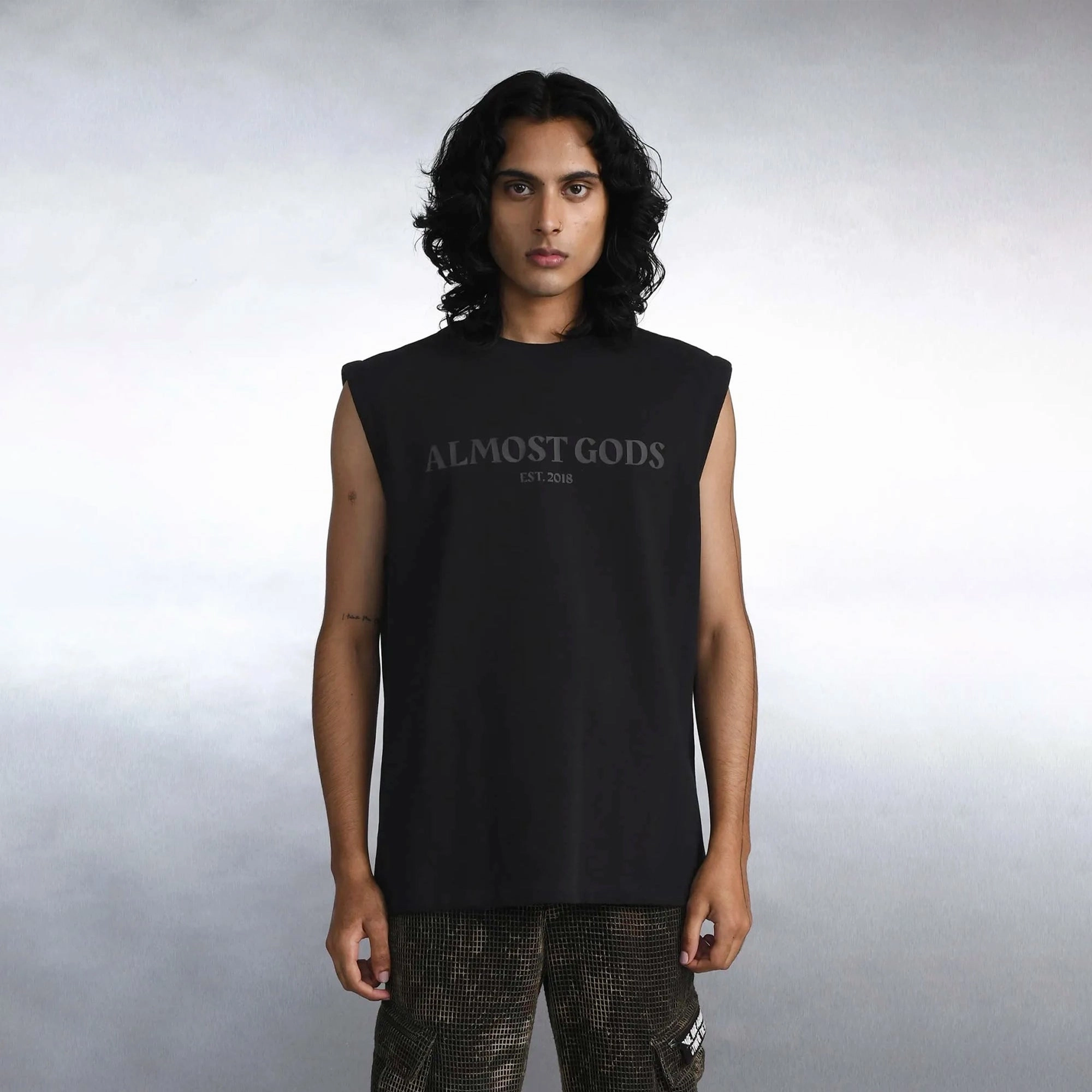 Stone Glow ALMOST GODS | EST 2018 SLEEVELESS TEE { BLACK