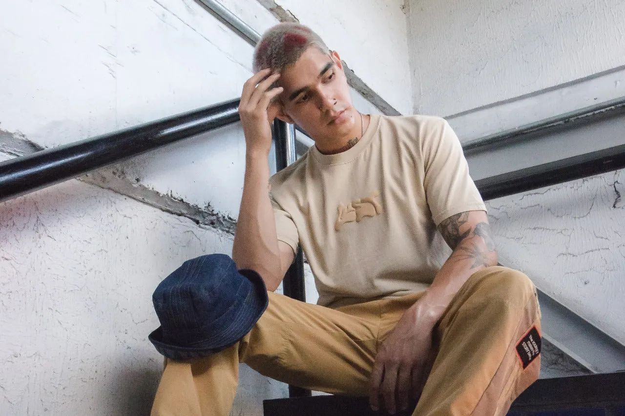 Tailored Silhouette Lust Brand Melting Logo Desert Tee