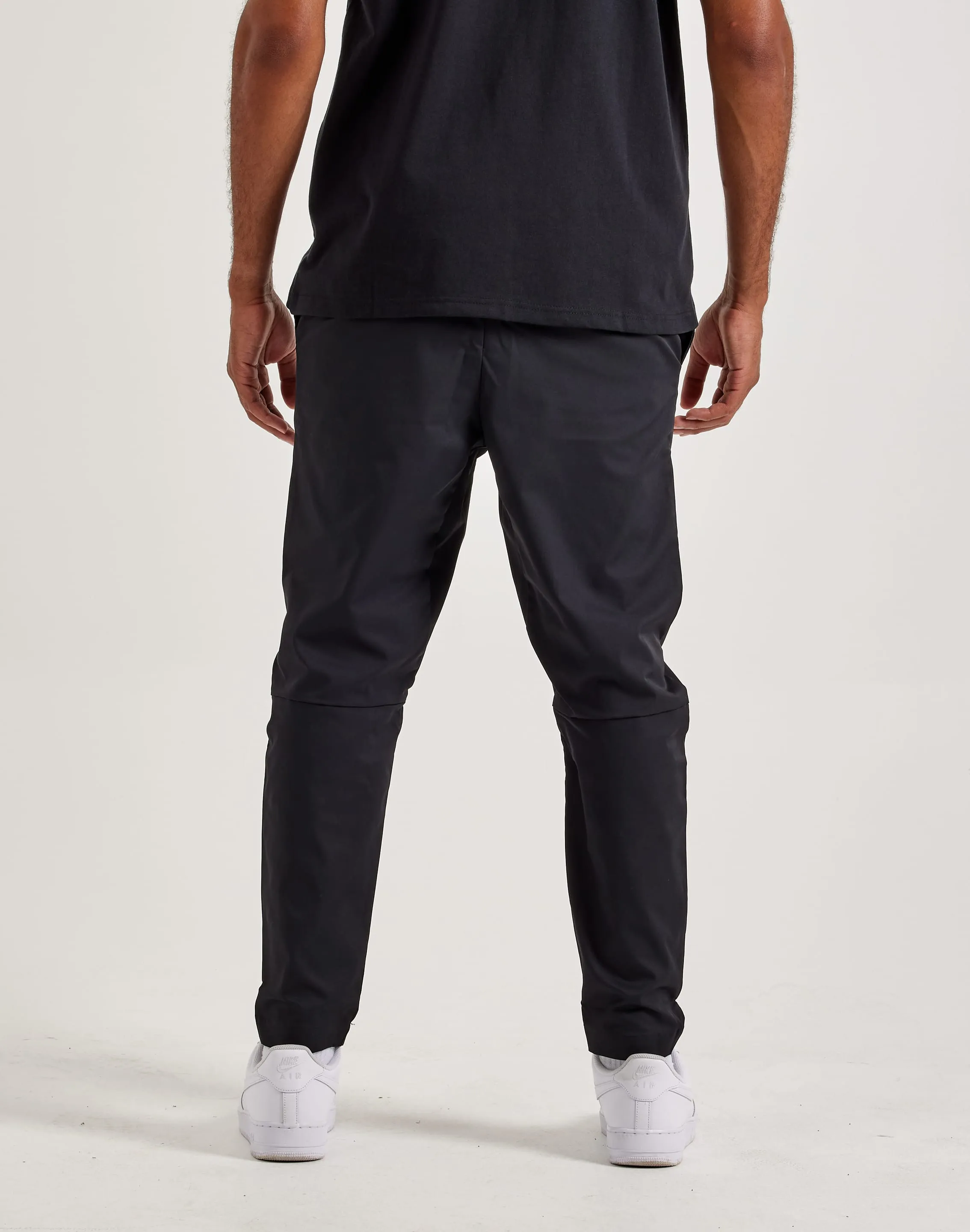 Gloss Glow Nike Club Woven Tapered Leg Pants