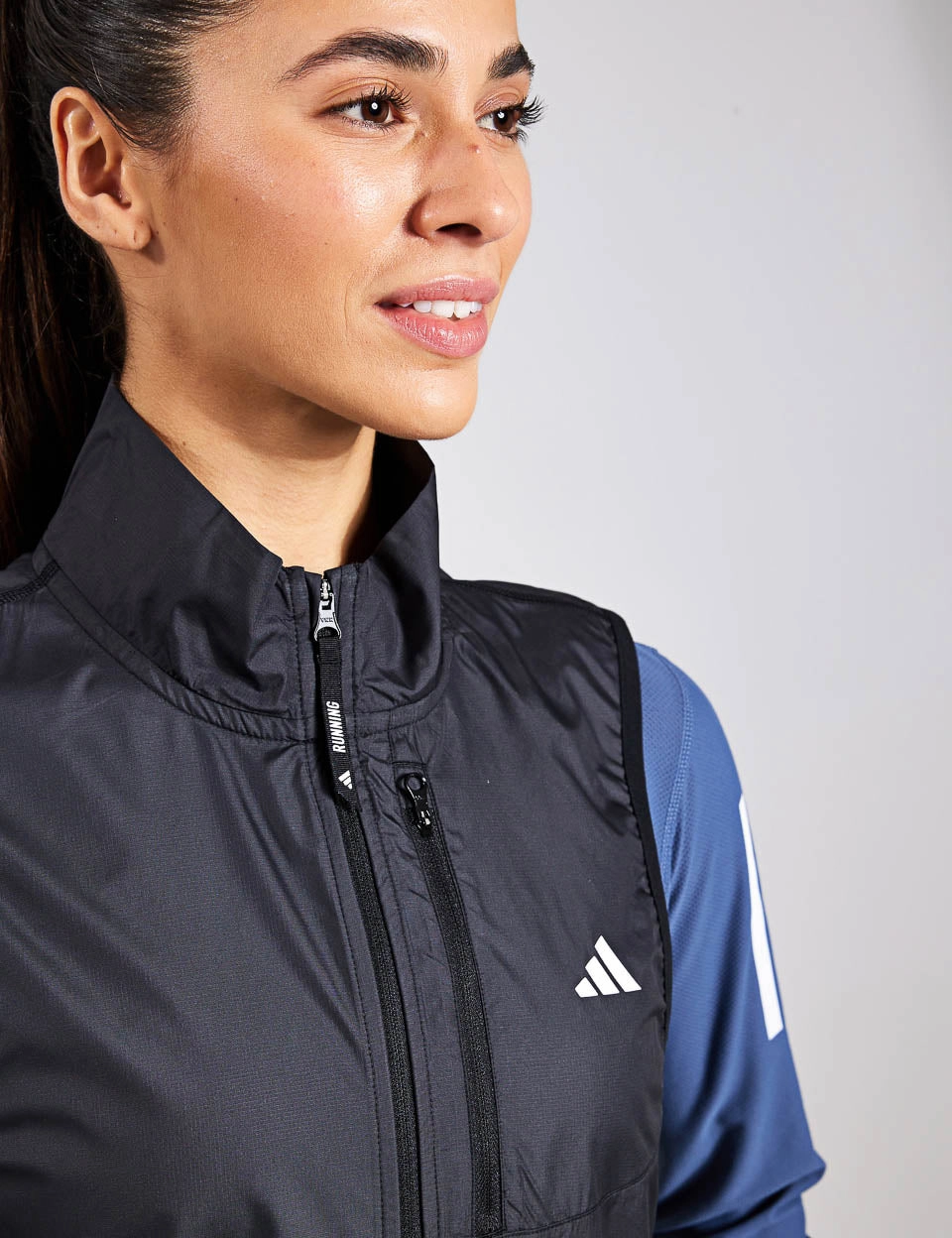 Own the Run Vest - Black Sleek Layer Fit Foldable Storage