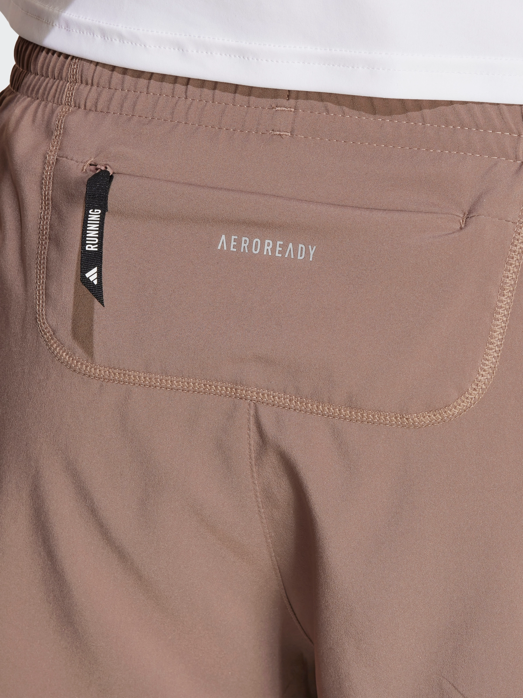 Flexible Material Own The Run Short