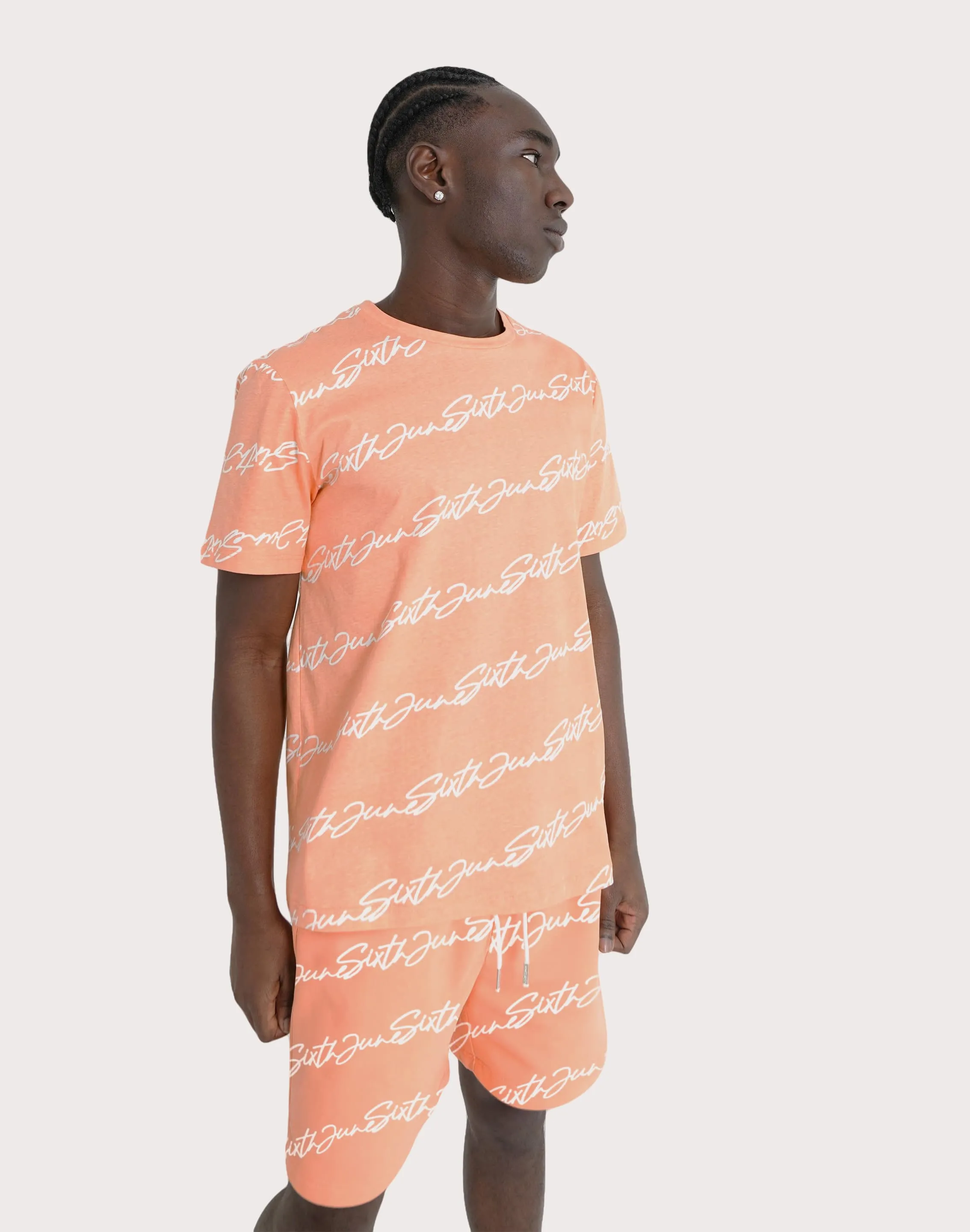SJP DISTRIBUTION COMPANY Sixth June All-Over-Print Script Tee Soft Flow Aerated Seam Placement