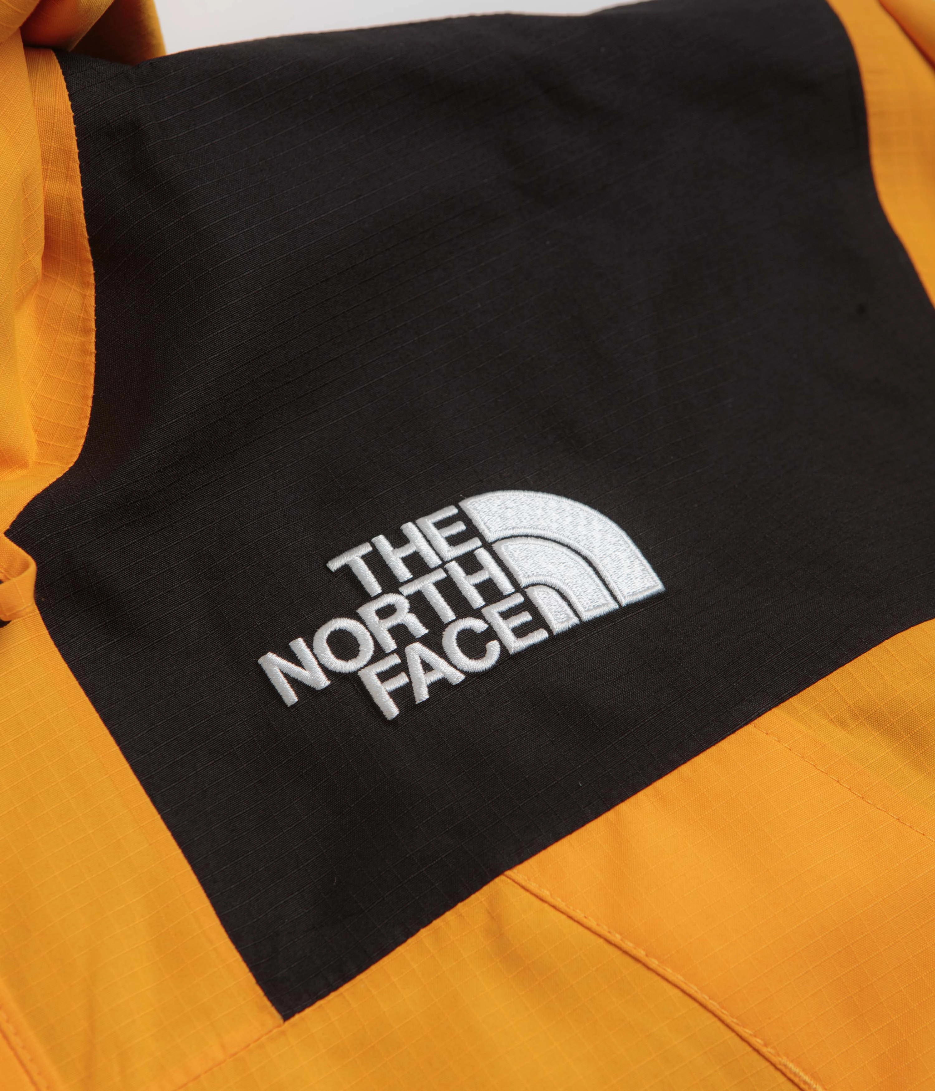Bracelet The North Face Dryvent Mono Mountain Jacket - Summit Gold / TNF Black